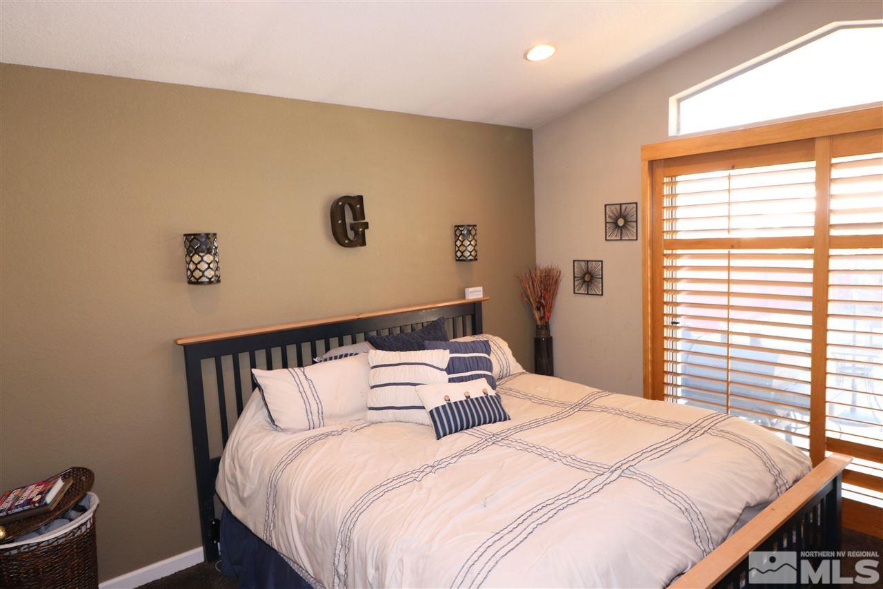 7658 Devonshire Lane Reno, NV 89511 - Photo 10 of 16 a bedroom with a bed and a window