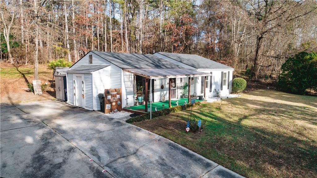 3184 Newcastle Way Snellville, GA 30039 - Photo 13 of 36 a front view of a house with a yard and porch