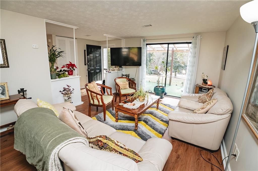 3184 Newcastle Way Snellville, GA 30039 - Photo 16 of 36 a living room with furniture and a flat screen tv