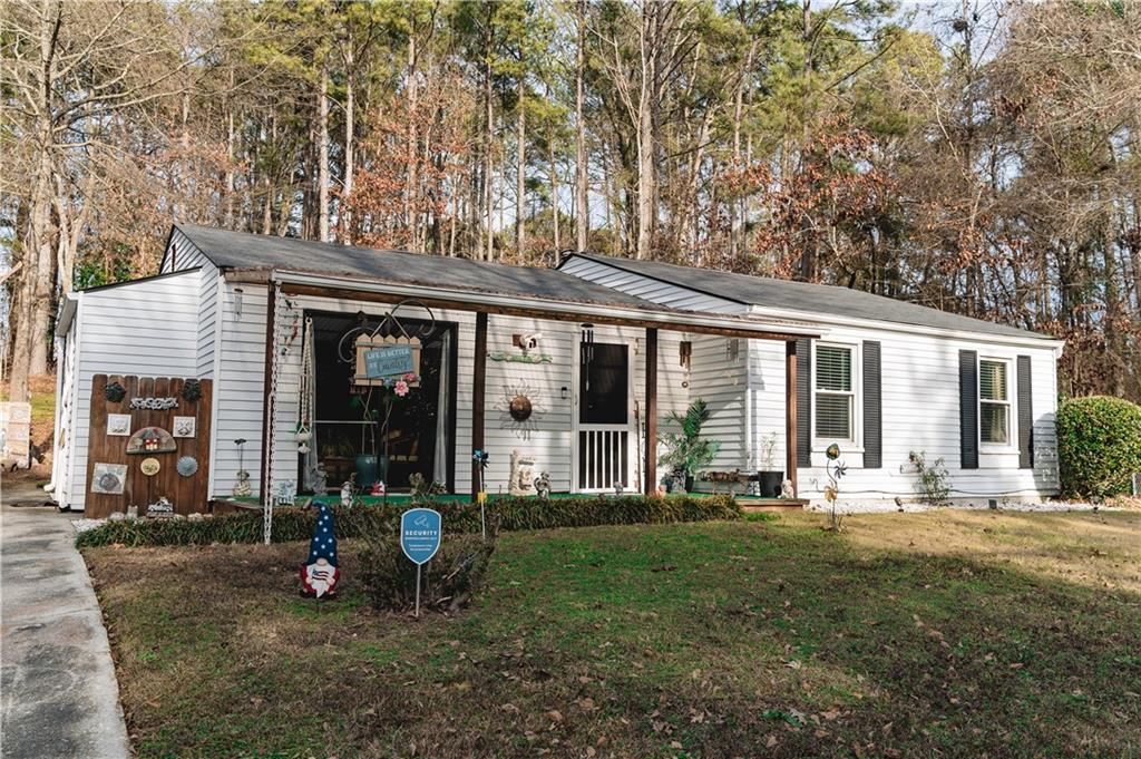 3184 Newcastle Way Snellville, GA 30039 - Photo 2 of 36 a view of a house with backyard porch and sitting area