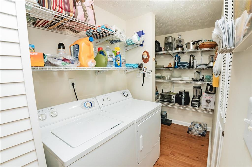 3184 Newcastle Way Snellville, GA 30039 - Photo 30 of 36 a utility room with dryer and washer