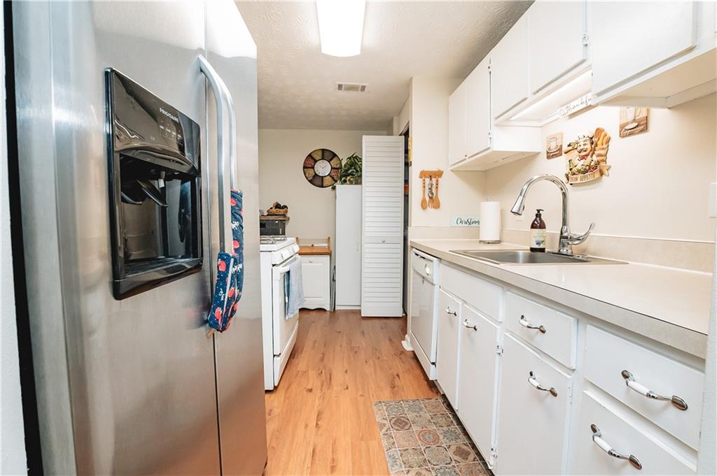 3184 Newcastle Way Snellville, GA 30039 - Photo 36 of 36 a bathroom with a sink a mirror and shower
