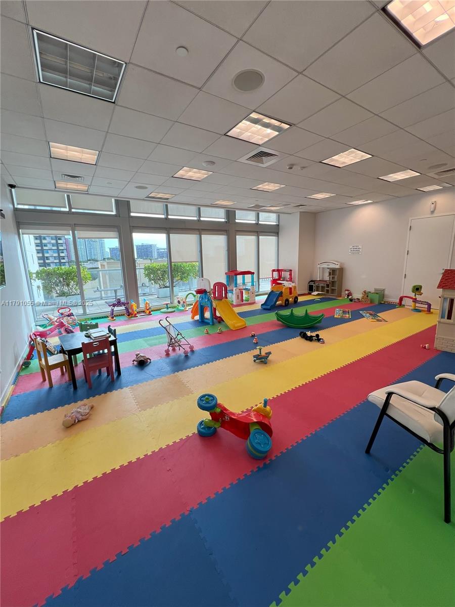 79 Southwest 12th Street, Unit 1710S Miami, FL 33130 - Photo 15 of 18 a room with lots of pool table and a large window