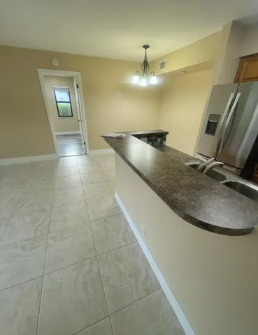 a spacious bathroom with a tub a toilet and a shower