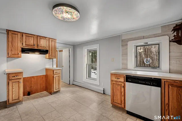 a view of a kitchen with electric appliances