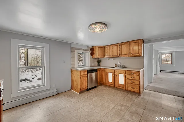 a view of a kitchen with a sink cabinets and a window