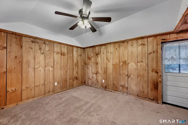 a view of a livingroom with a chandelier fan