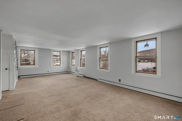 an empty room with windows