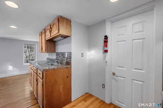 a kitchen with a stove and a refrigerator