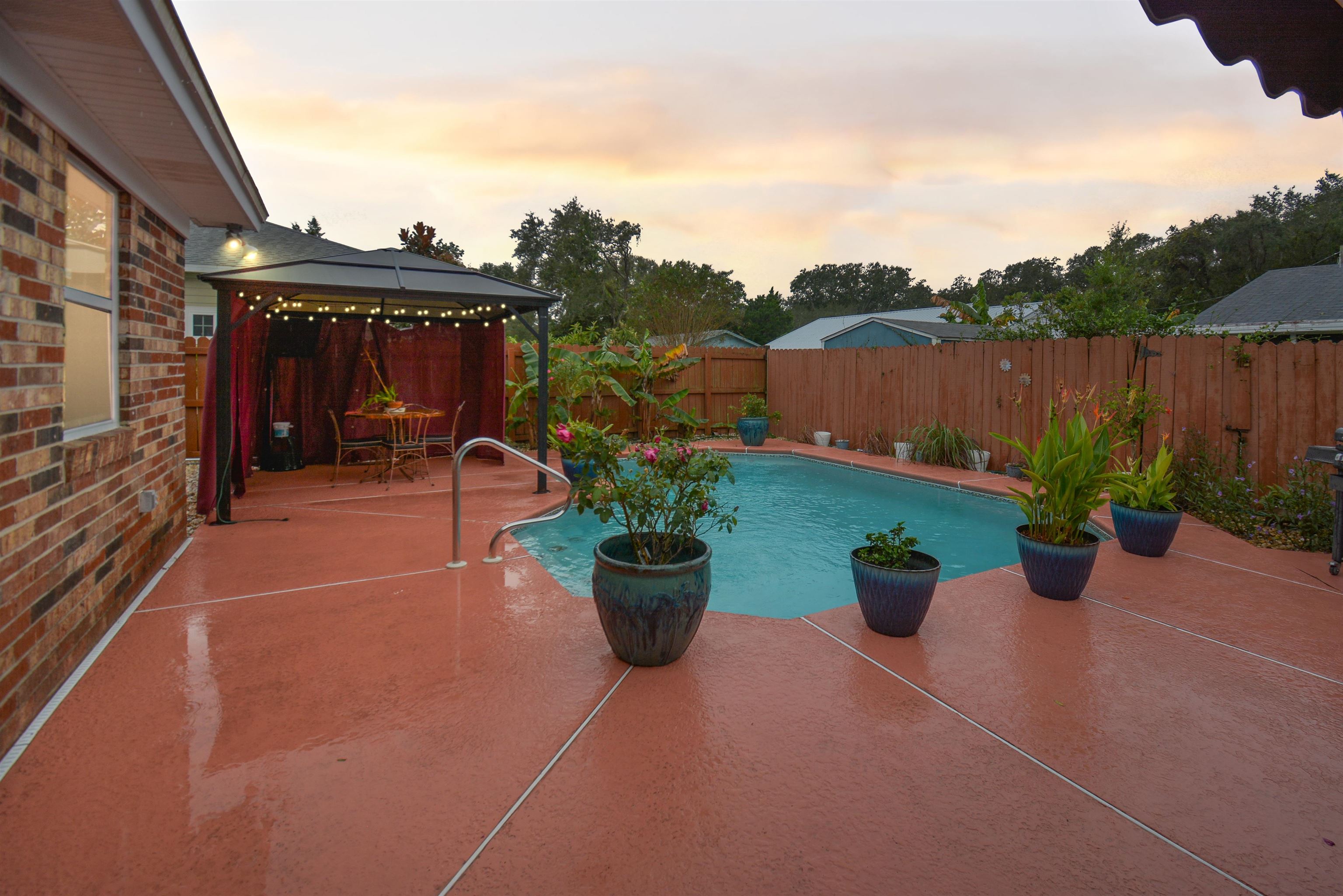 424 Segovia Road St. Augustine, FL 32086 - Photo 22 of 25 a view of a chair and tables back yard of the house