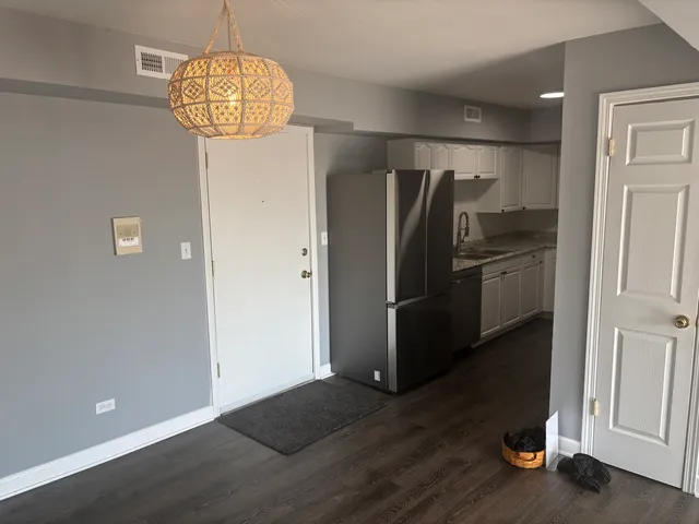 a view of cabinets and wooden floor