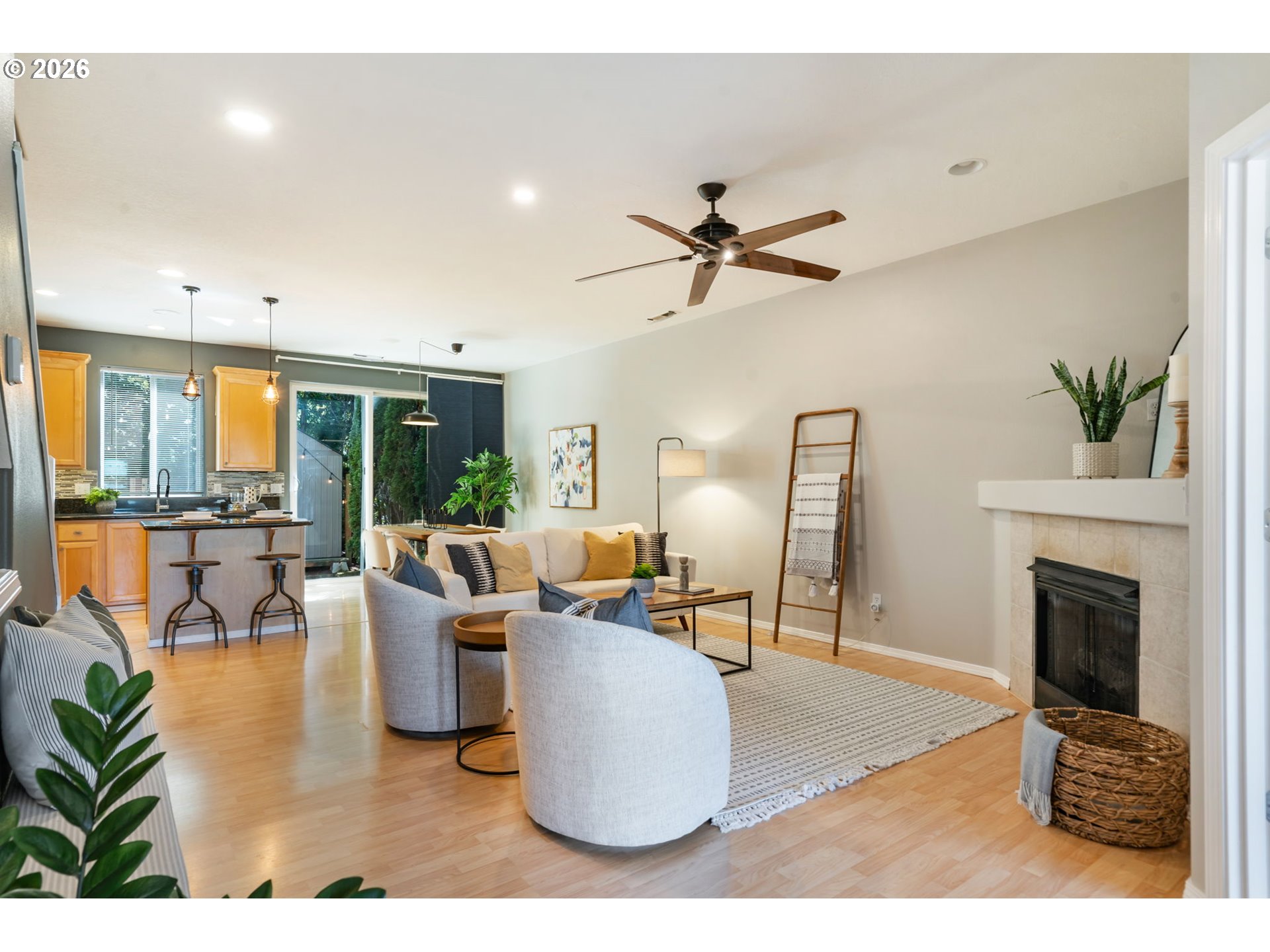 13159 Southwest Brianne Way Portland, OR 97223 - Photo 5 of 32 a living room with furniture a fireplace and a floor to ceiling window