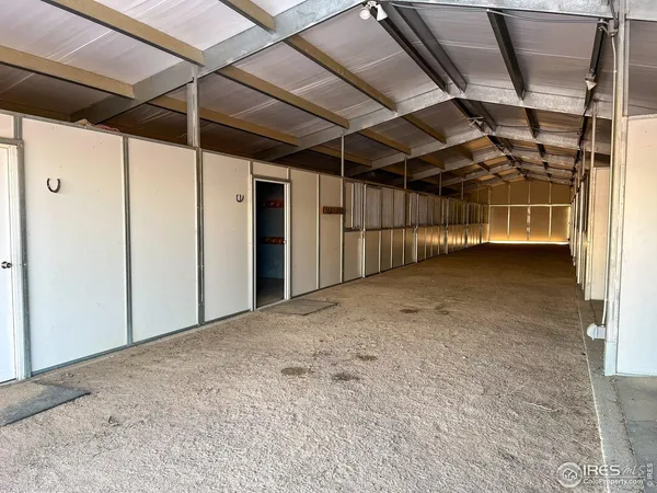 a view of empty room with wooden walls