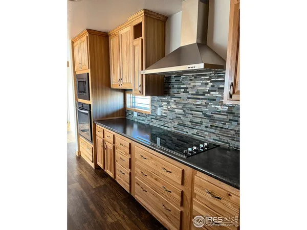 a kitchen with sink and cabinets