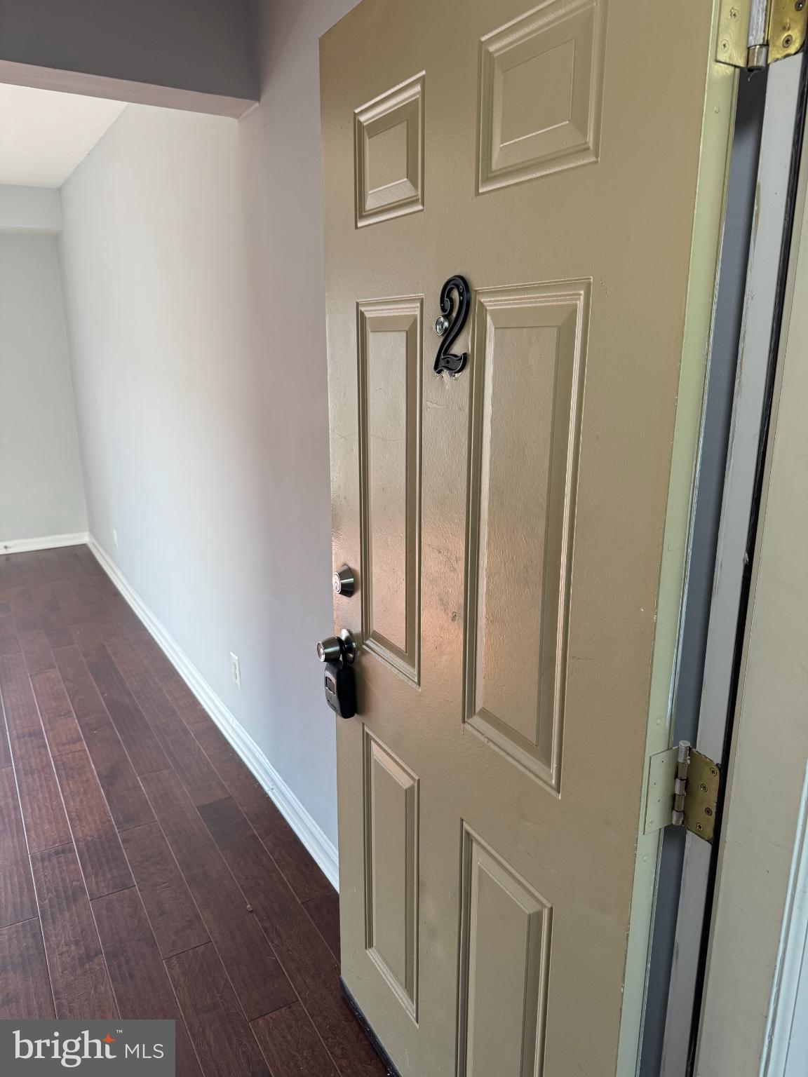 2500 Markham Lane, Unit 2 Landover, MD 20785 - Photo 25 of 27 a view of a hallway with wooden floor and staircase