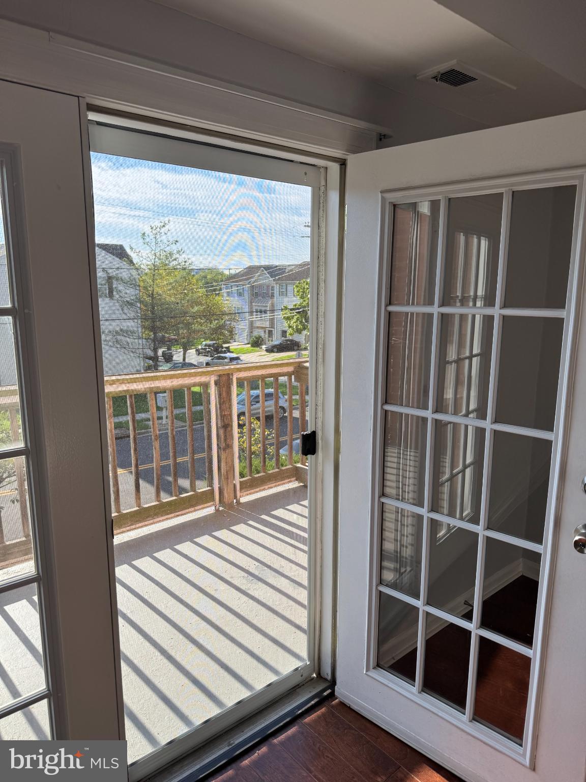 2500 Markham Lane, Unit 2 Landover, MD 20785 - Photo 26 of 27 a view of a balcony with wooden floor and windows