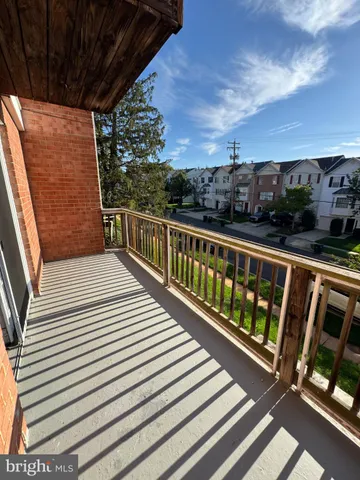 a view of a balcony with wooden floor