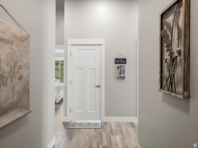 608 Fremont Road Fish Haven, ID 83287 - Photo 5 of 35 Modern interior featuring wood-finish flooring, light gray wall tones, and white trim