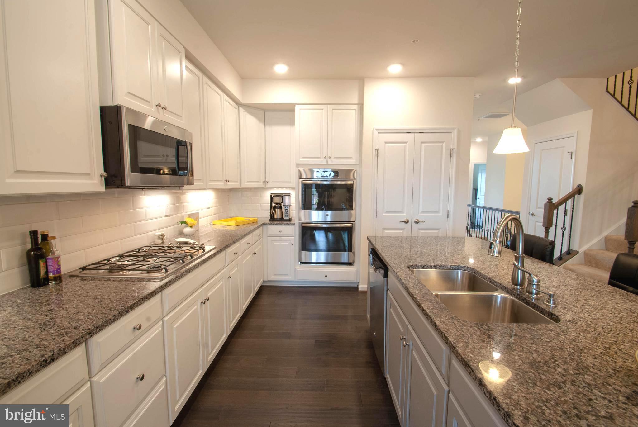 8038 Orchard Grove Road, Unit 20 Odenton, MD 21113 - Photo 14 of 30 Sleek Granite & Stainless Chef's Kitchen