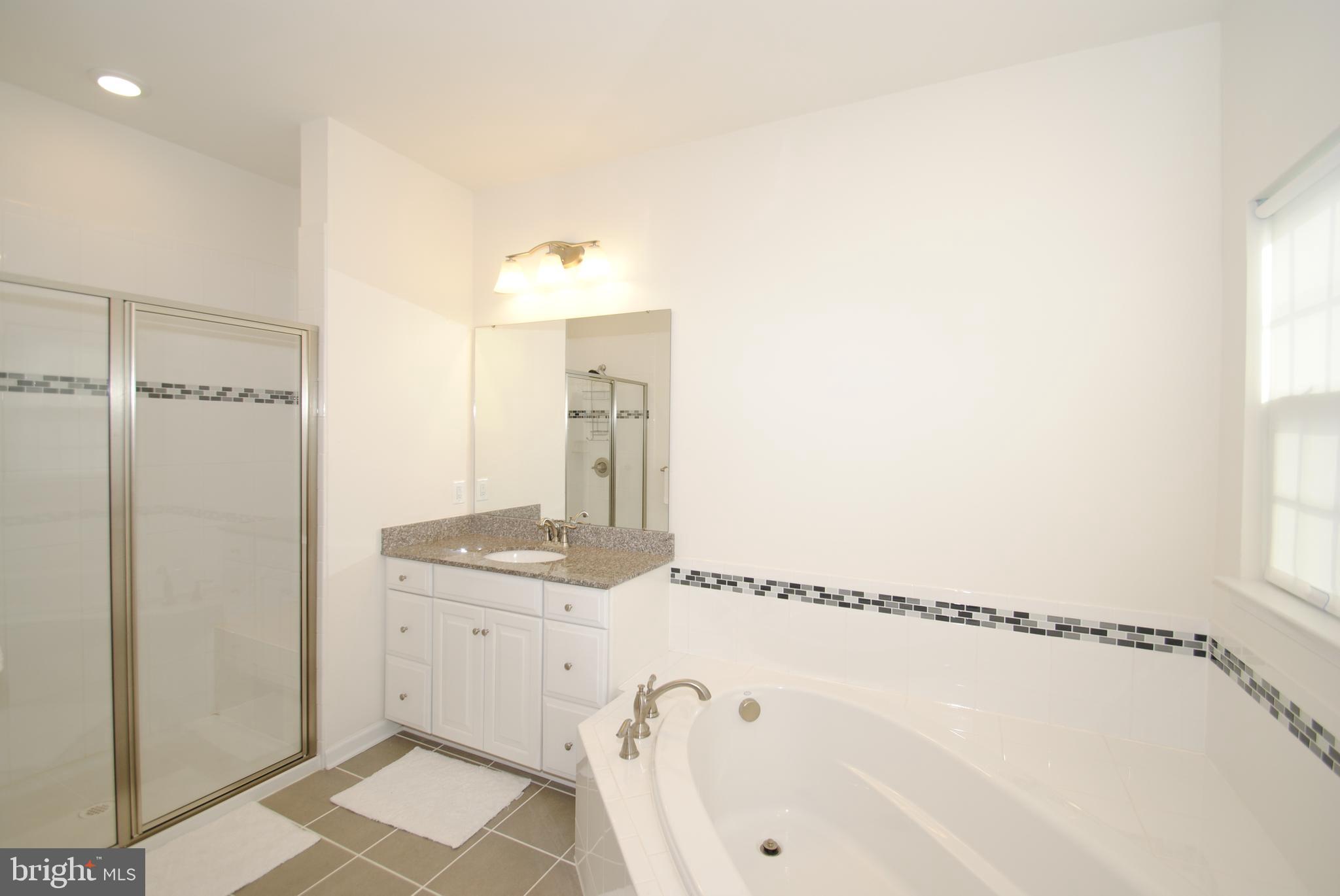 8038 Orchard Grove Road, Unit 20 Odenton, MD 21113 - Photo 22 of 30 Dual Vanities . Spa Soaking Tub . Separate Shower