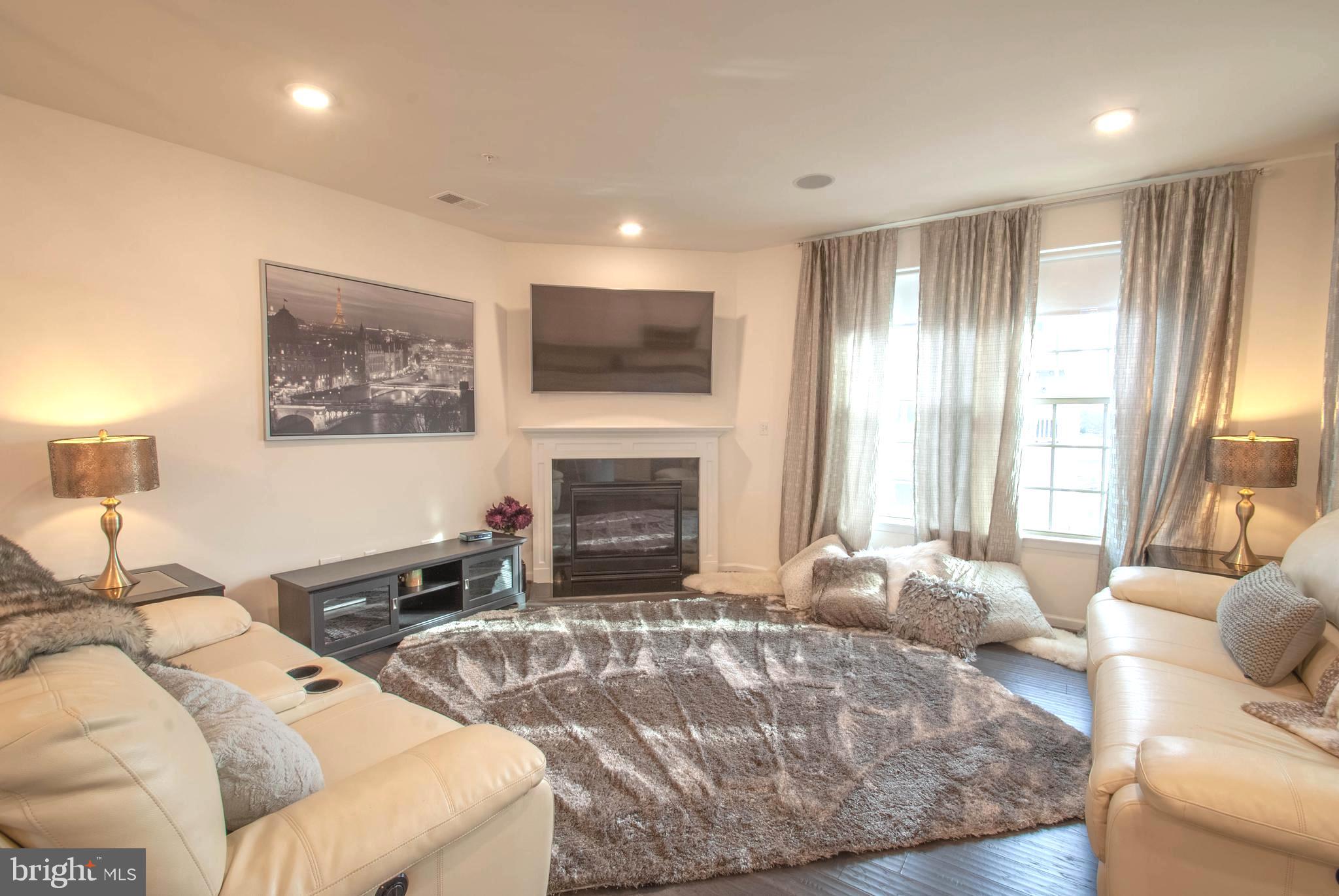 8038 Orchard Grove Road, Unit 20 Odenton, MD 21113 - Photo 4 of 30 Relax in Your Family Room by the Fireplace Glow!