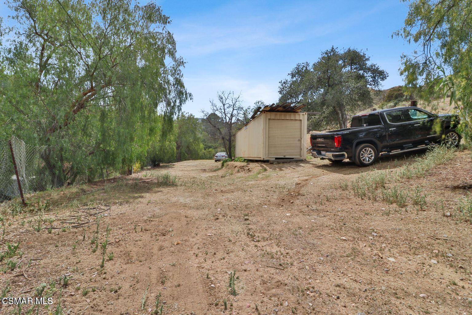 Oak Knolls Road Simi Valley, CA 93063 - Photo 21 of 23 a view of backyard with parked cars