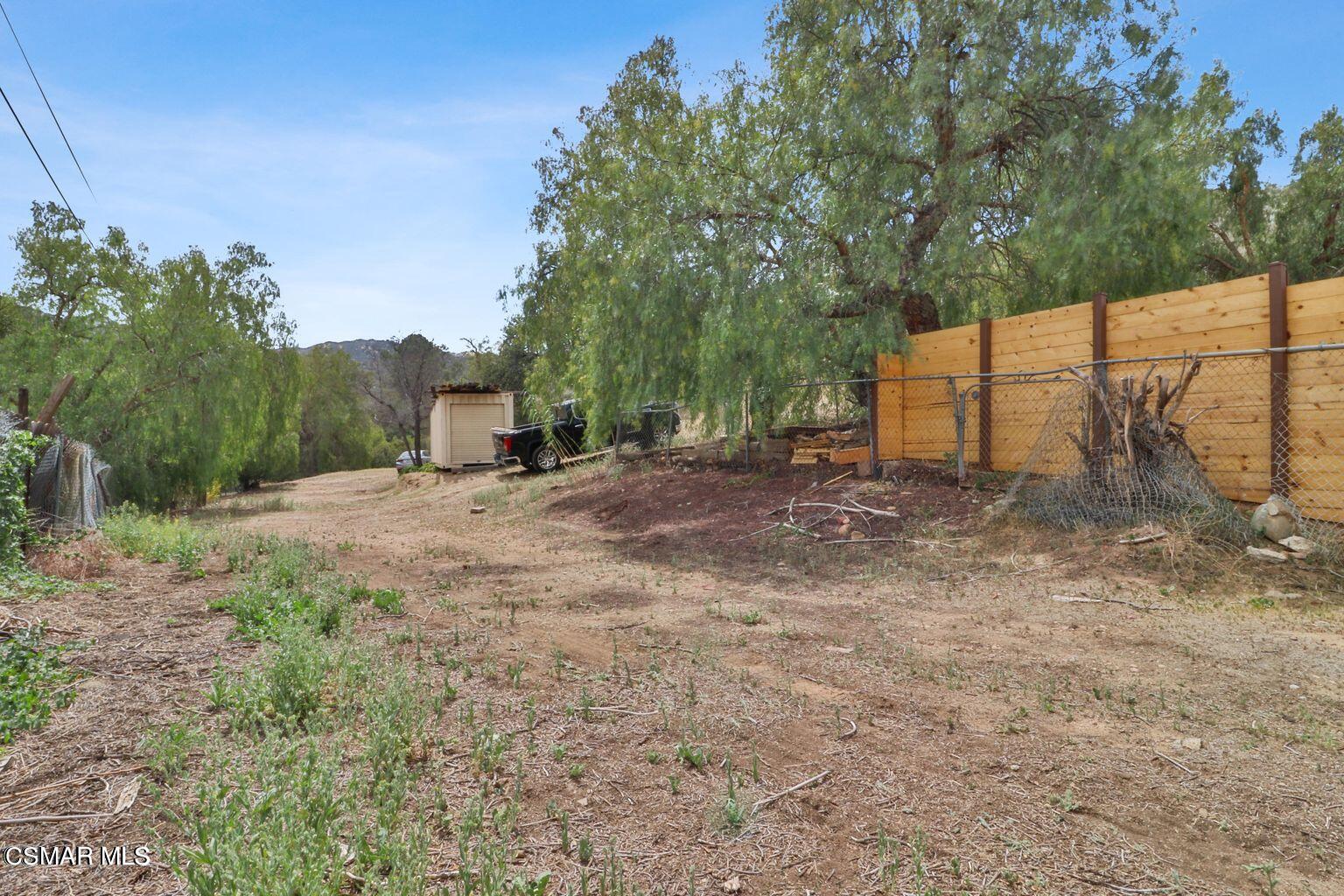 Oak Knolls Road Simi Valley, CA 93063 - Photo 22 of 23 a view of a backyard of the house