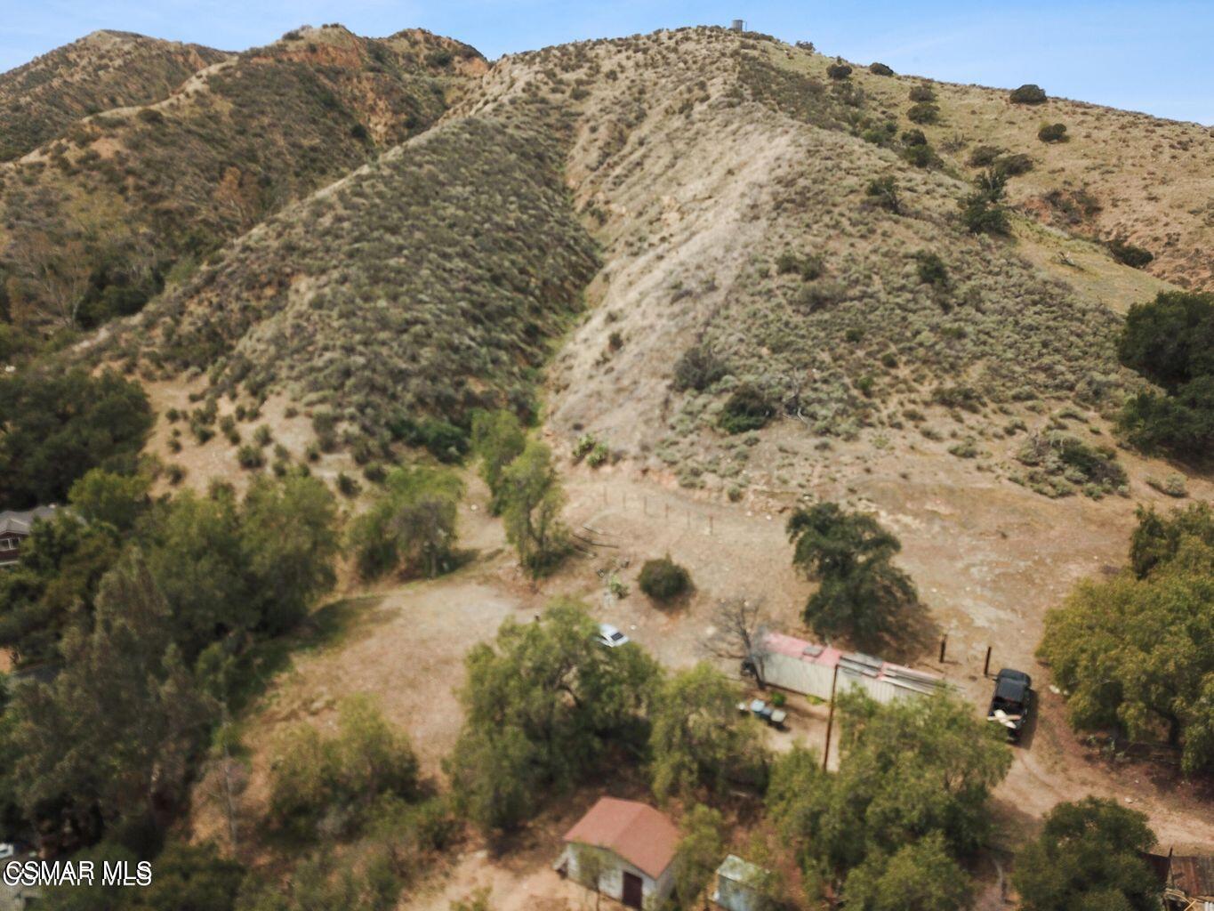 Oak Knolls Road Simi Valley, CA 93063 - Photo 8 of 23 a view of a dry yard with mountains in the background