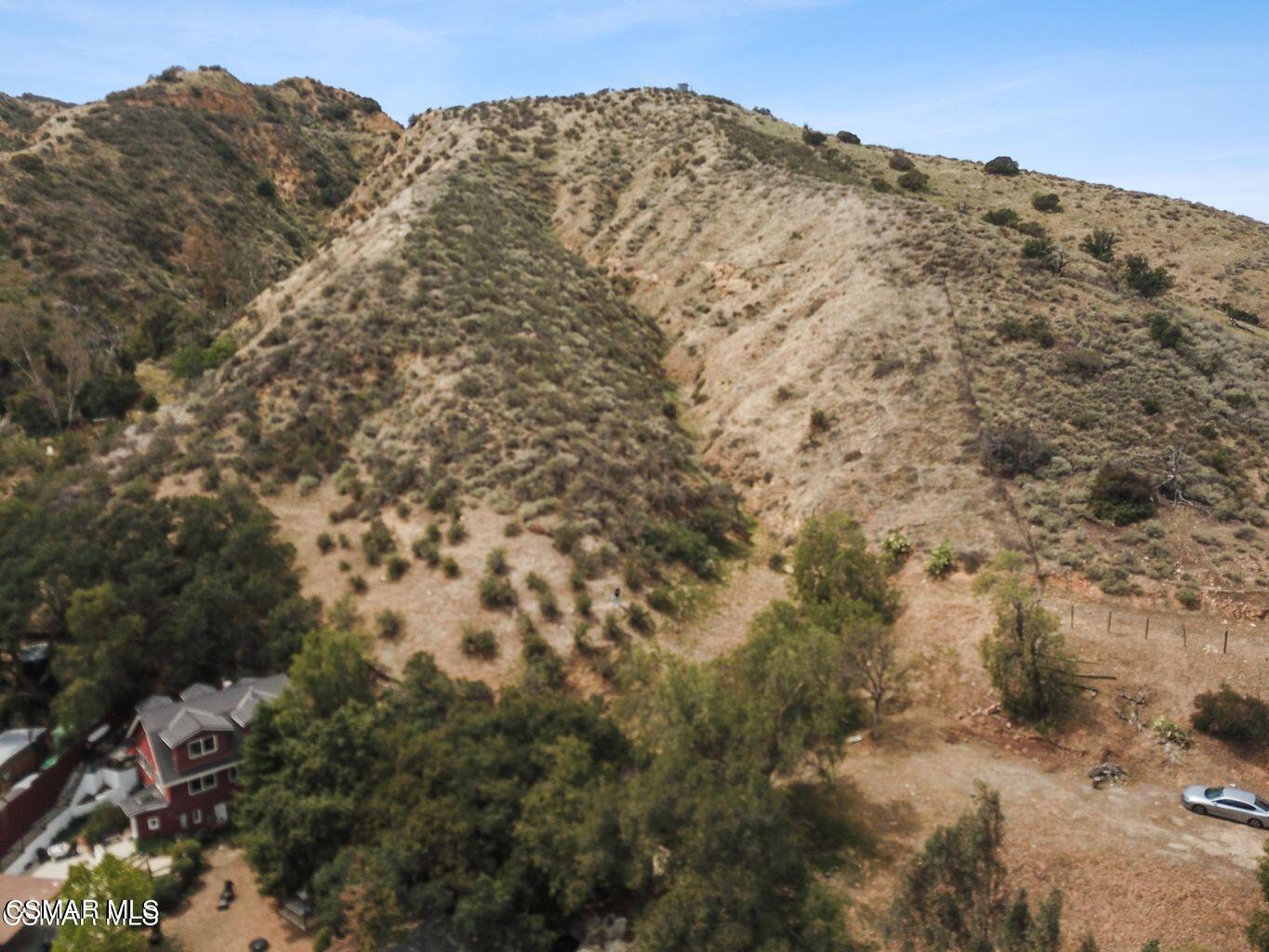 Oak Knolls Road Simi Valley, CA 93063 - Photo 9 of 23 a view of a large building with mountains in the background