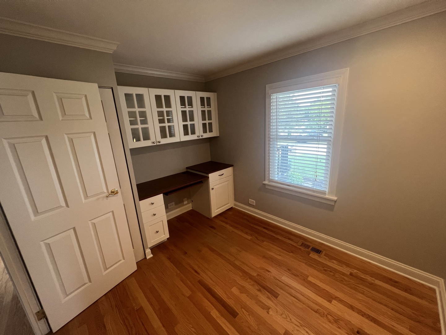 7830 Westview Lane Woodridge, IL 60517 - Photo 15 of 26 a view of an empty room with wooden floor and a window