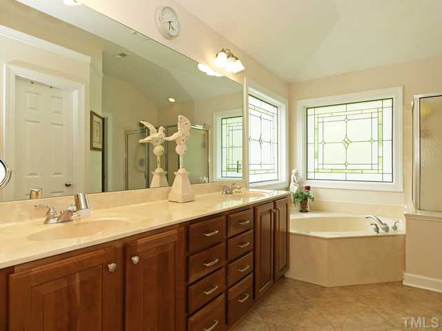 4449 Fairview Ridge Lane Apex, NC 27539 - Photo 12 of 25 HUGE VANITY WITH DOUBLE SINKS AND GARDEN SOAKING TUB!