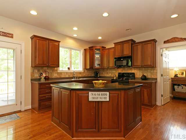 CUSTOM CHERRY KITCHEN IS ISLAND AND RECESSED LIGHTING!