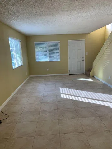 a view of an empty room with windows