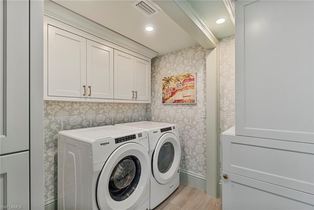 176 South Collier Boulevard, Unit 101 Marco Island, FL 34145 - Photo 27 of 50 a utility room with dryer and washer
