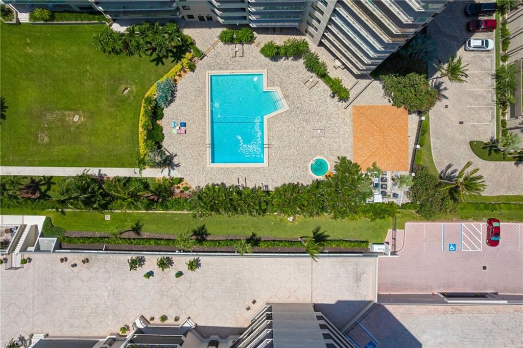 176 South Collier Boulevard, Unit 101 Marco Island, FL 34145 - Photo 47 of 50 an aerial view of a house with a yard
