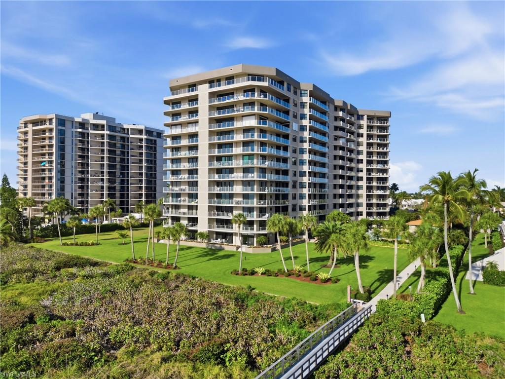 176 South Collier Boulevard, Unit 101 Marco Island, FL 34145 - Photo 48 of 50 a front view of a multi story building