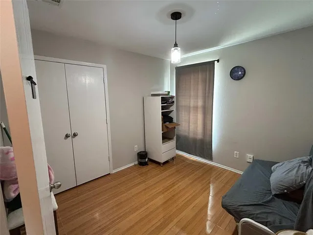 a room that has a bed and a dresser in it