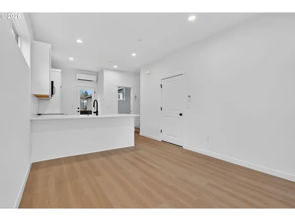 a view of entryway with wooden floor