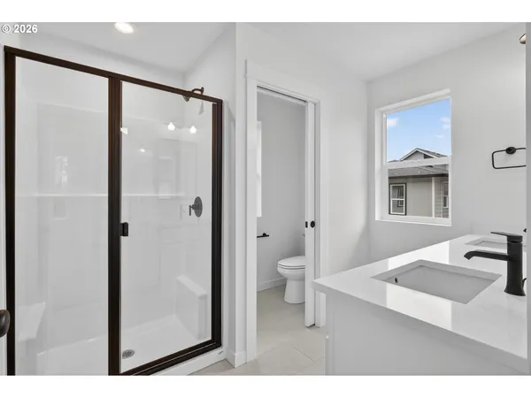 a bathroom with a double vanity sink mirror and double