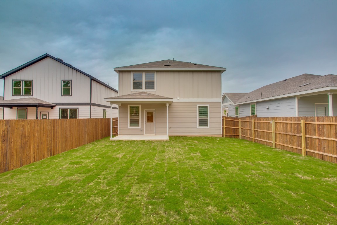 148 Spotted Rail Ridge Leander, TX 78641 - Photo 29 of 31 A spacious, newly landscaped backyard offers ample outdoor enjoyment behind this charming residence.