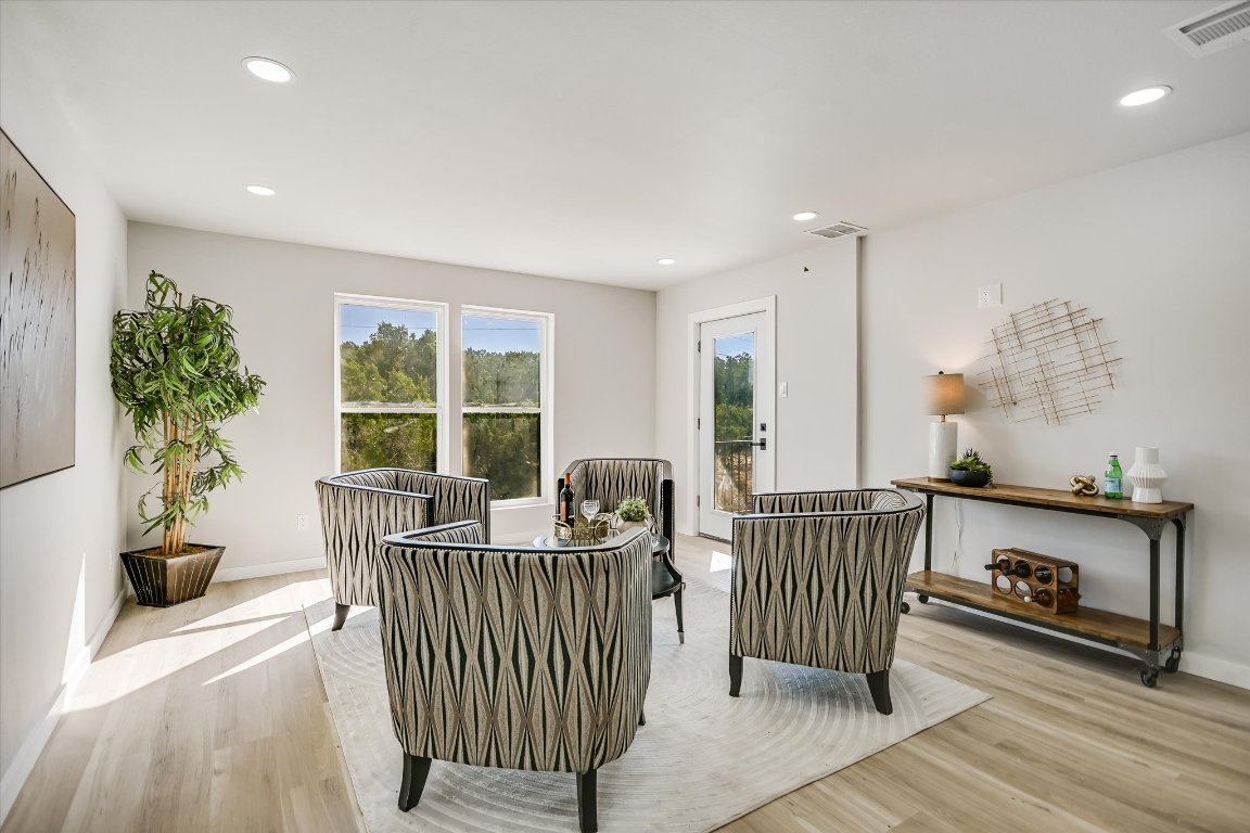 52 War Bonnet Wimberley, TX 78676 - Photo 12 of 31 a living room with furniture and a floor to ceiling window
