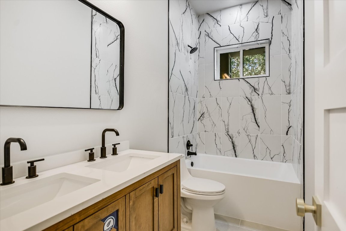 52 War Bonnet Wimberley, TX 78676 - Photo 18 of 31 a bathroom with a sink a toilet and shower