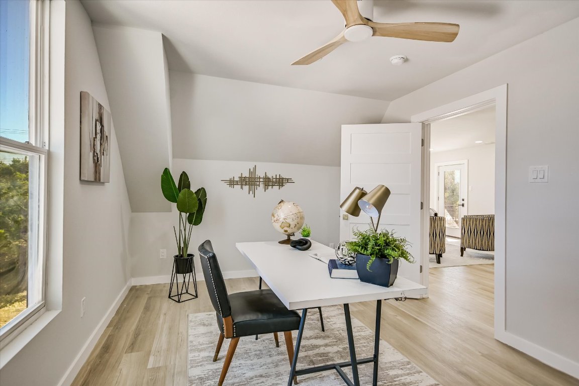 52 War Bonnet Wimberley, TX 78676 - Photo 24 of 31 a dining room with furniture potted plants and wooden floor