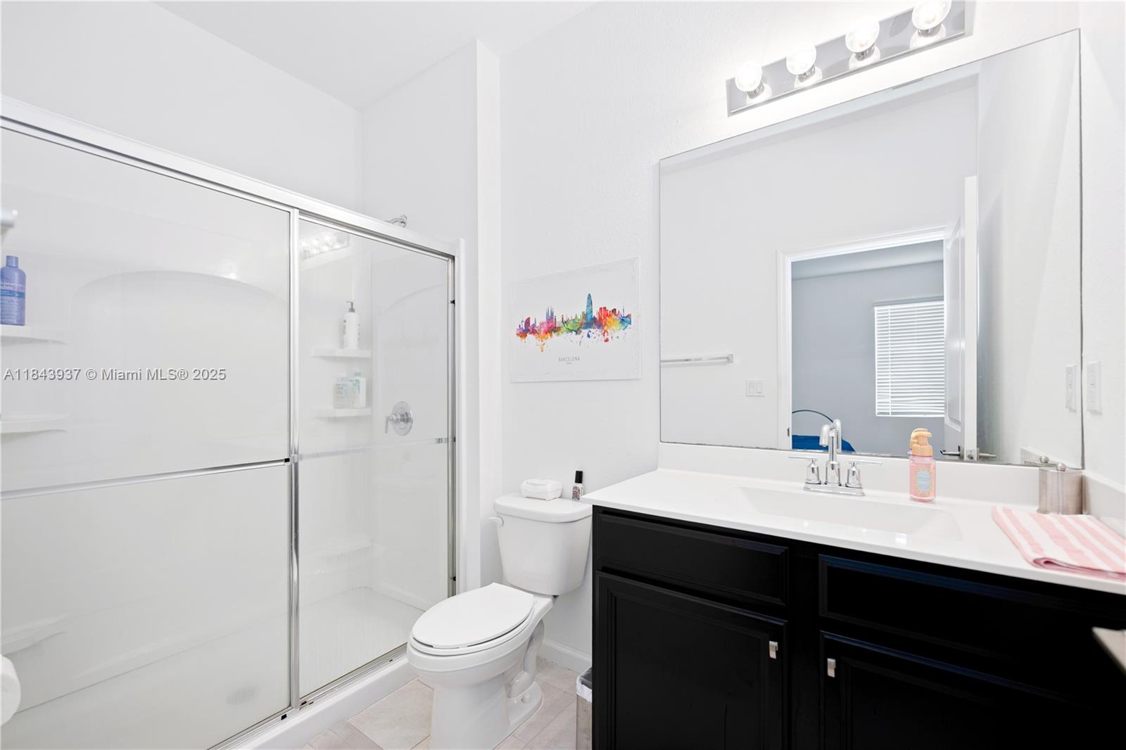 1106 Northwest 40th Terrace Lauderhill, FL 33313 - Photo 14 of 20 a bathroom with a sink vanity mirror and toilet