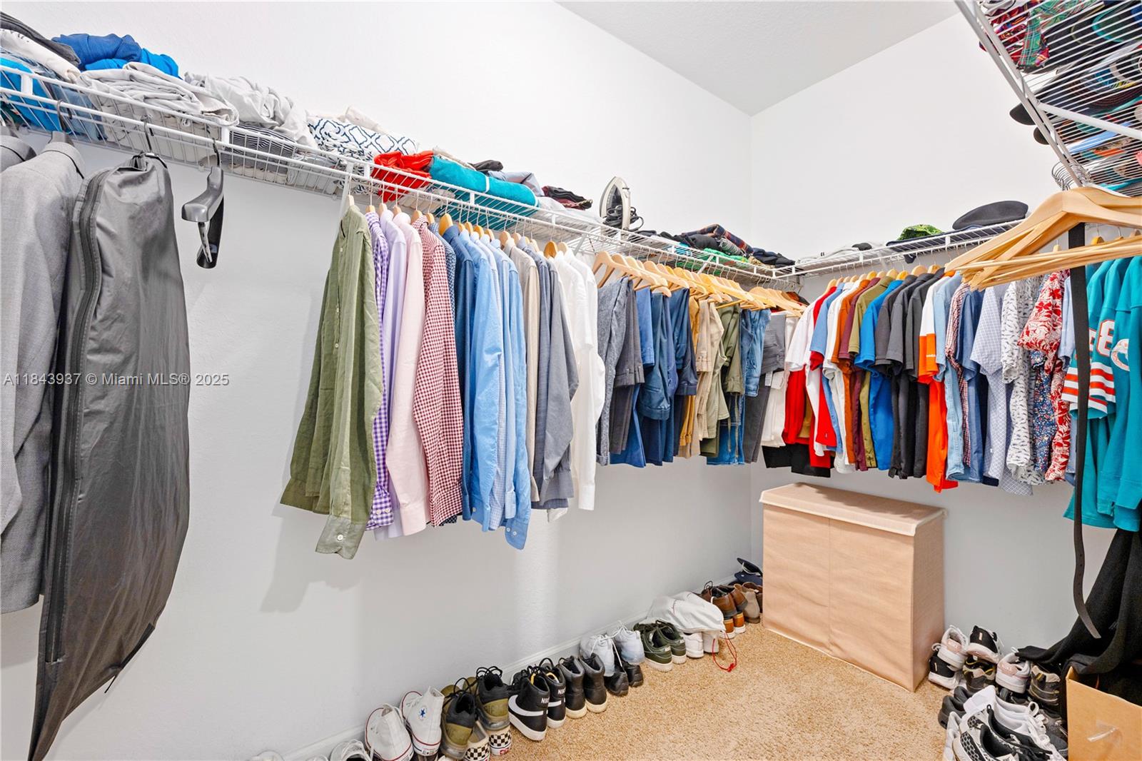 1106 Northwest 40th Terrace Lauderhill, FL 33313 - Photo 15 of 20 a view of walk in closet with clothes and shoes