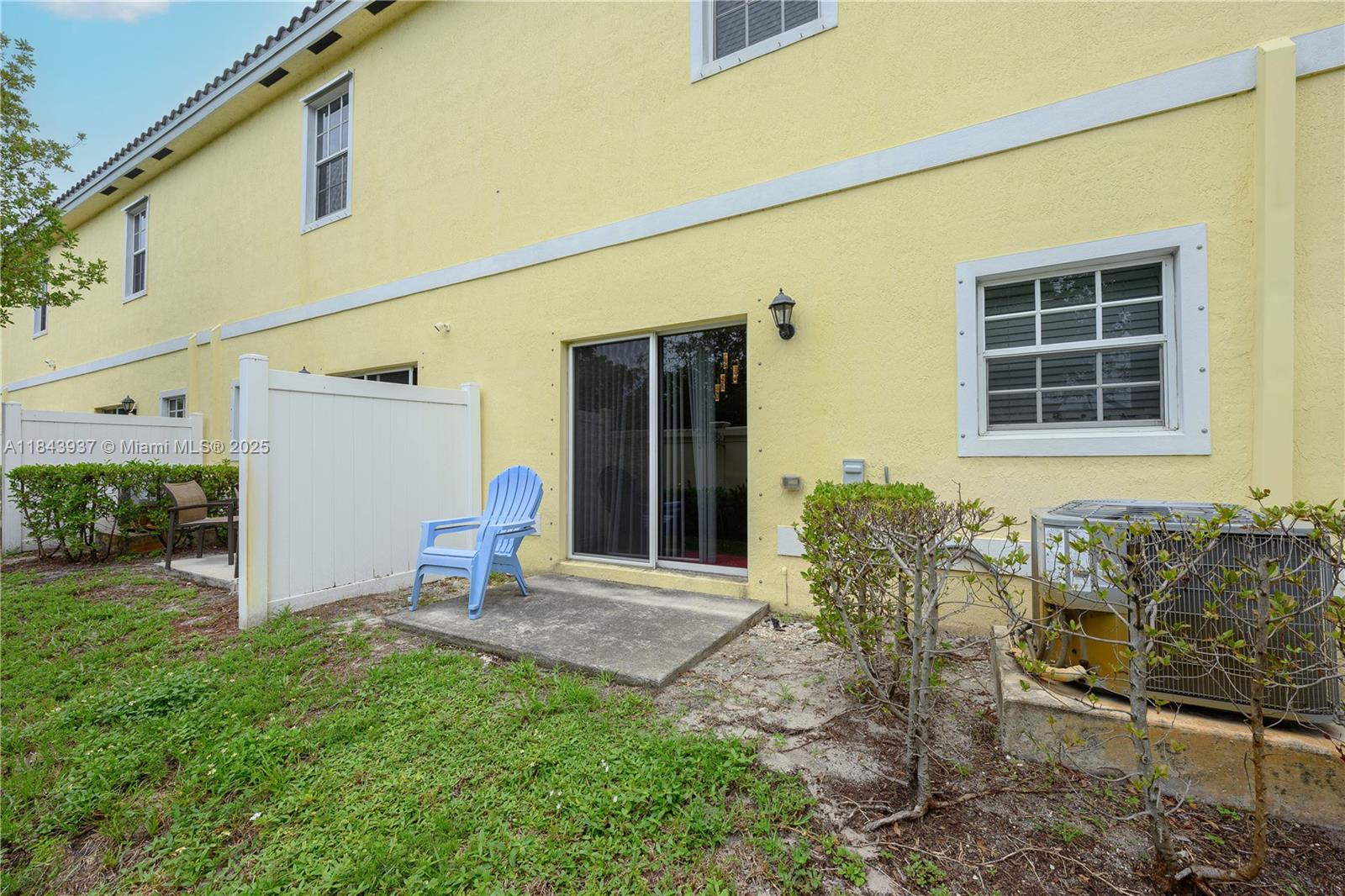 1106 Northwest 40th Terrace Lauderhill, FL 33313 - Photo 17 of 20 a backyard of a house with outdoor seating