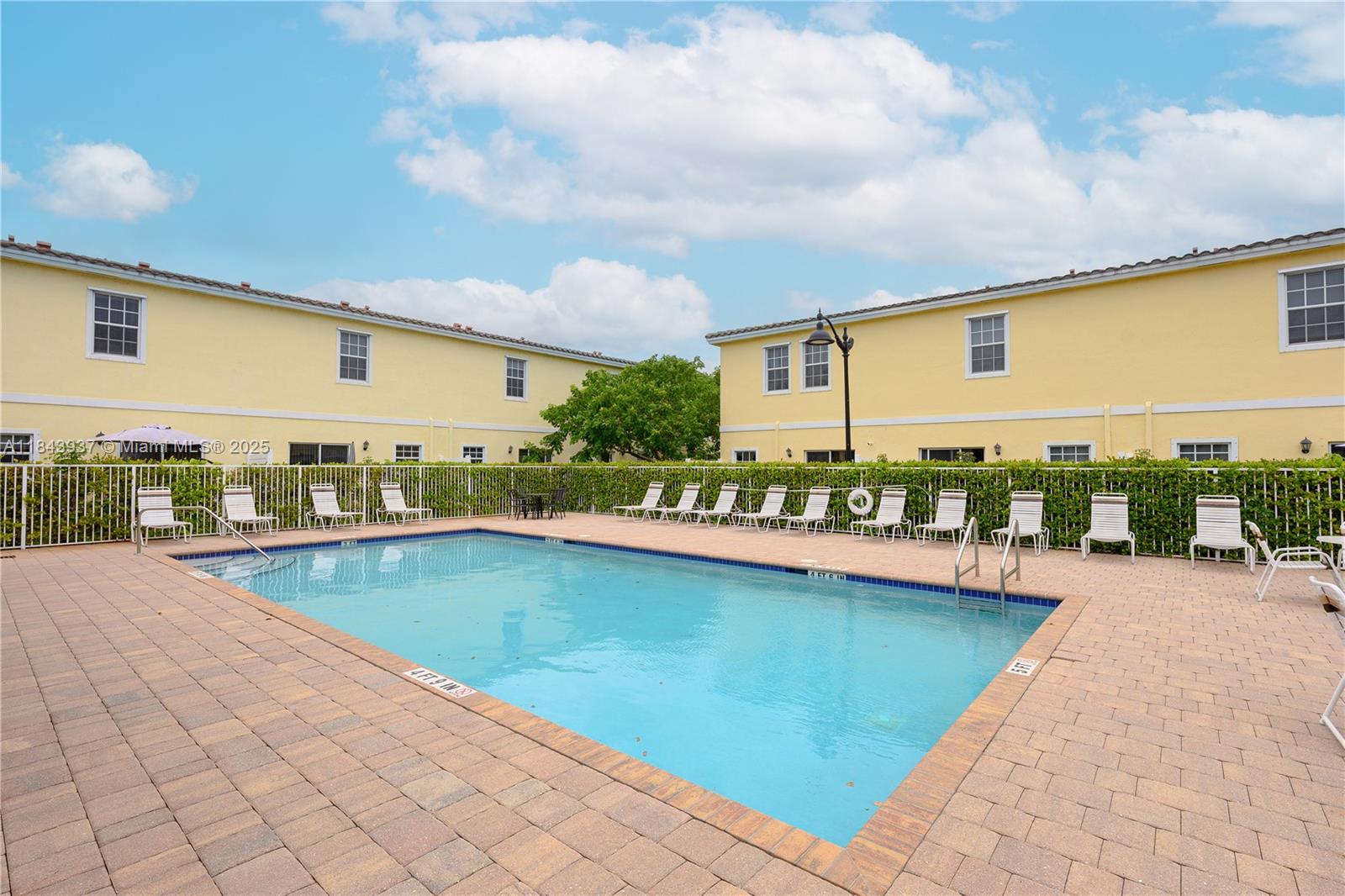 1106 Northwest 40th Terrace Lauderhill, FL 33313 - Photo 18 of 20 a view of a swimming pool with a lounge chair