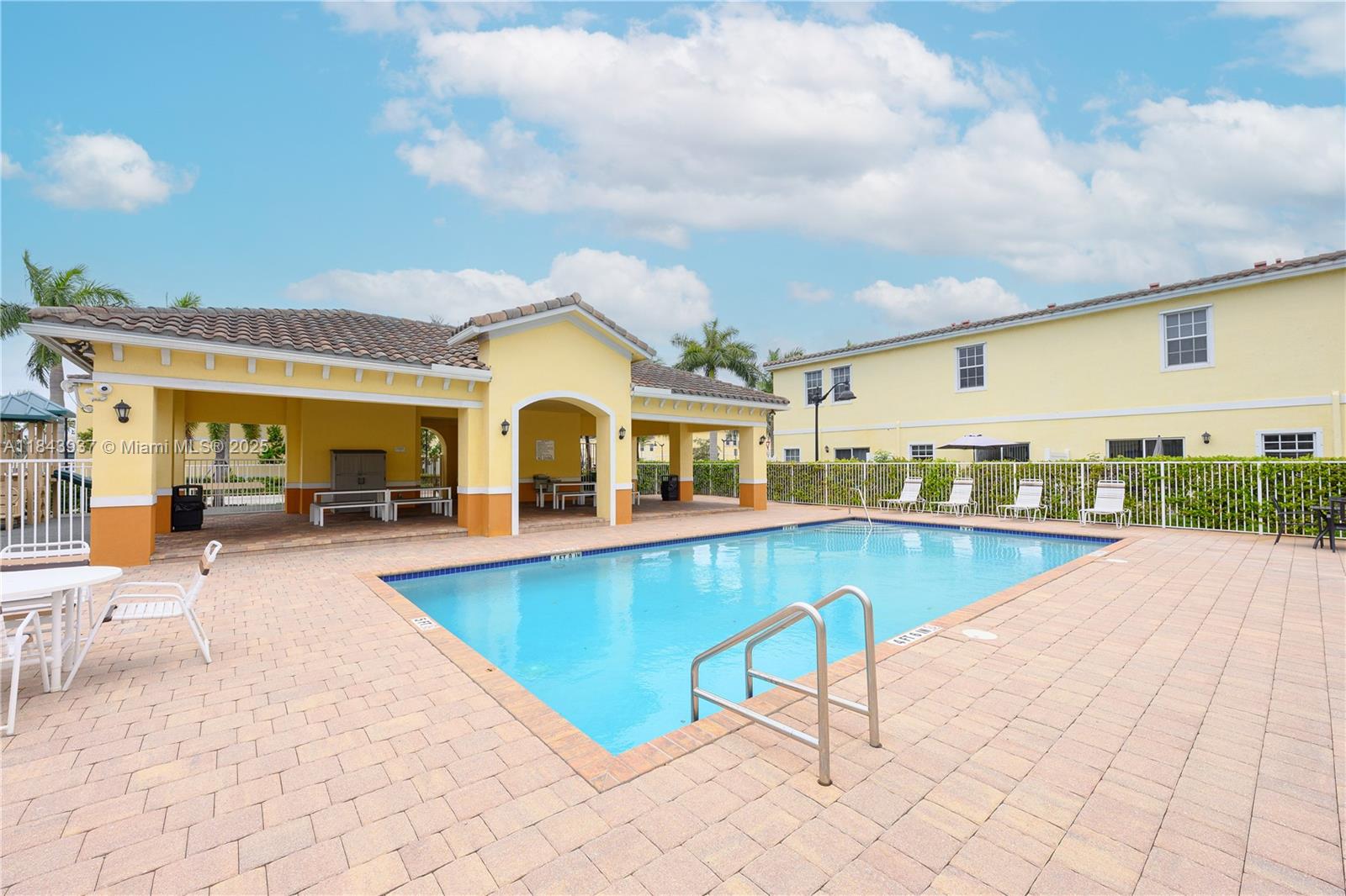 1106 Northwest 40th Terrace Lauderhill, FL 33313 - Photo 20 of 20 a view of a house with swimming pool and sitting area