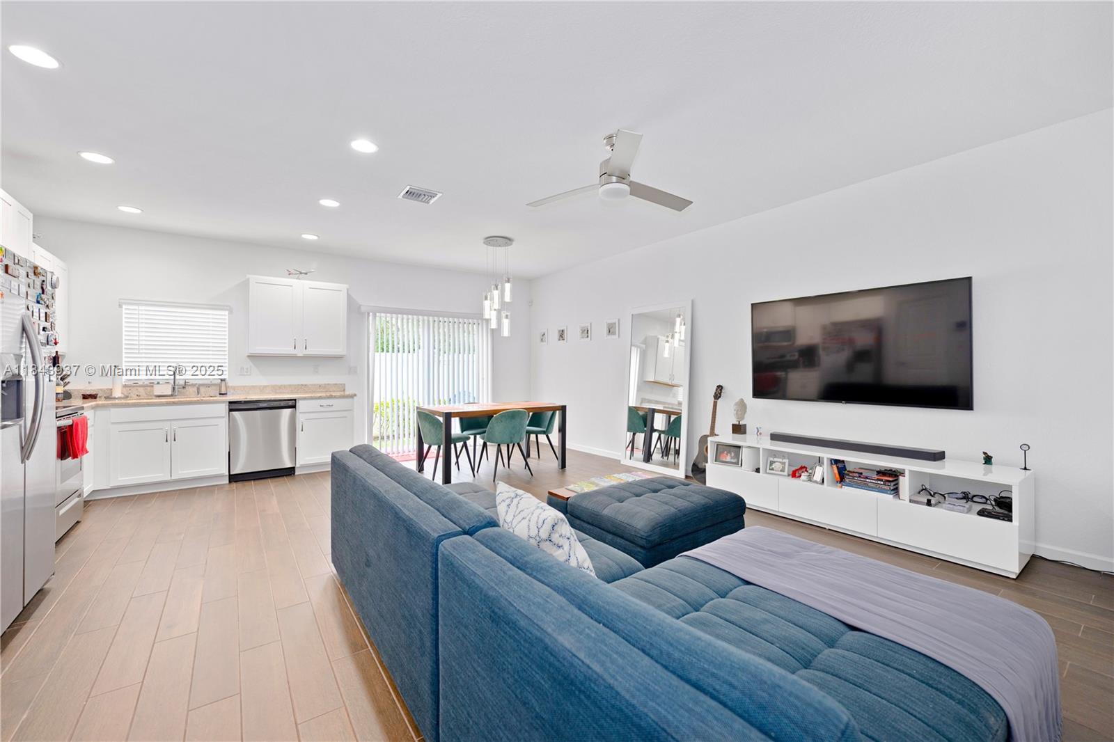 1106 Northwest 40th Terrace Lauderhill, FL 33313 - Photo 2 of 20 a living room with furniture and a flat screen tv