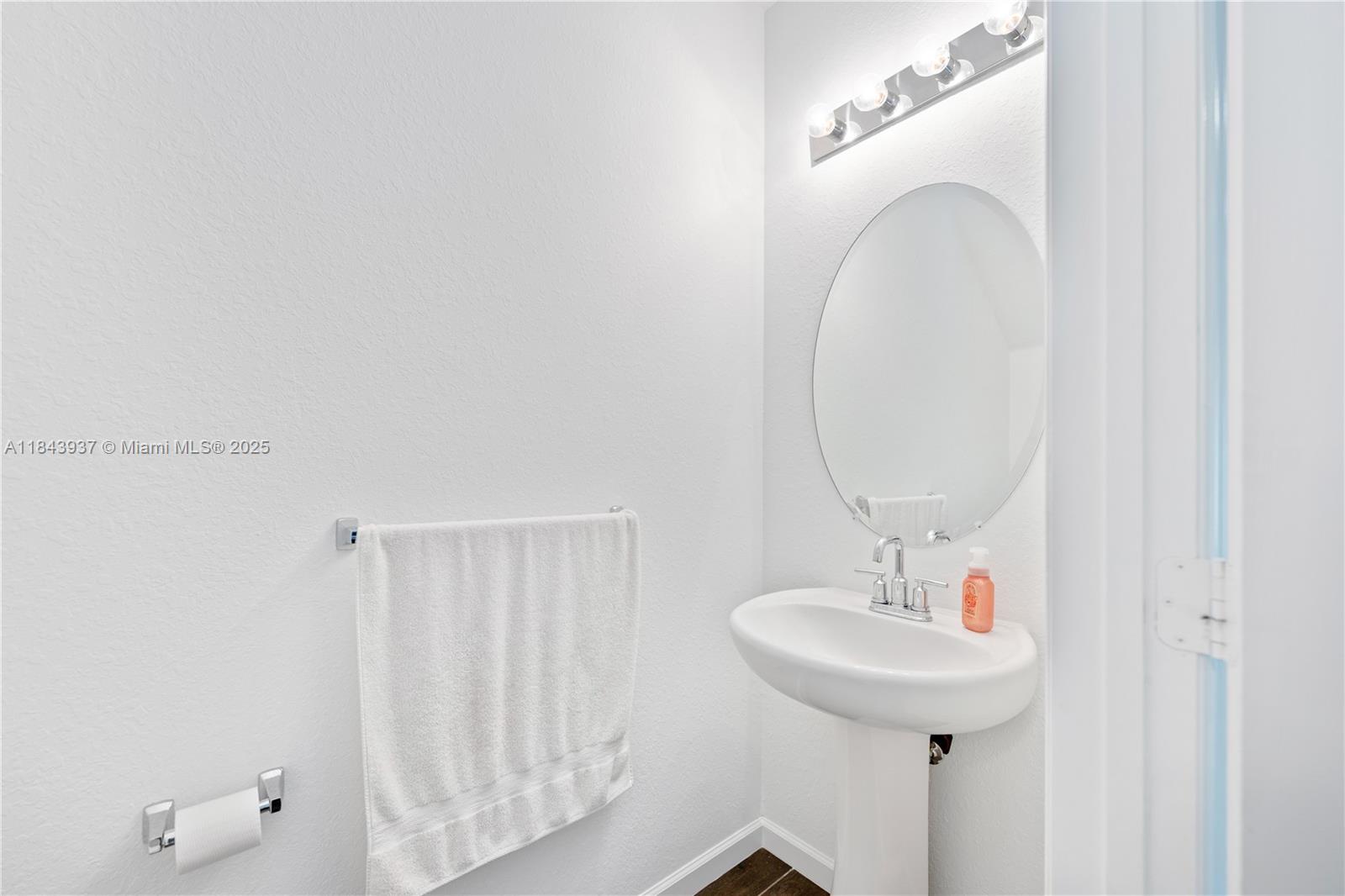 1106 Northwest 40th Terrace Lauderhill, FL 33313 - Photo 7 of 20 a bathroom with a sink and a mirror